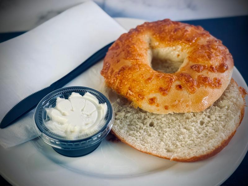 Cheese bagel with cream cheese spread