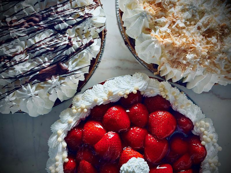 Assorted pies with whipped cream