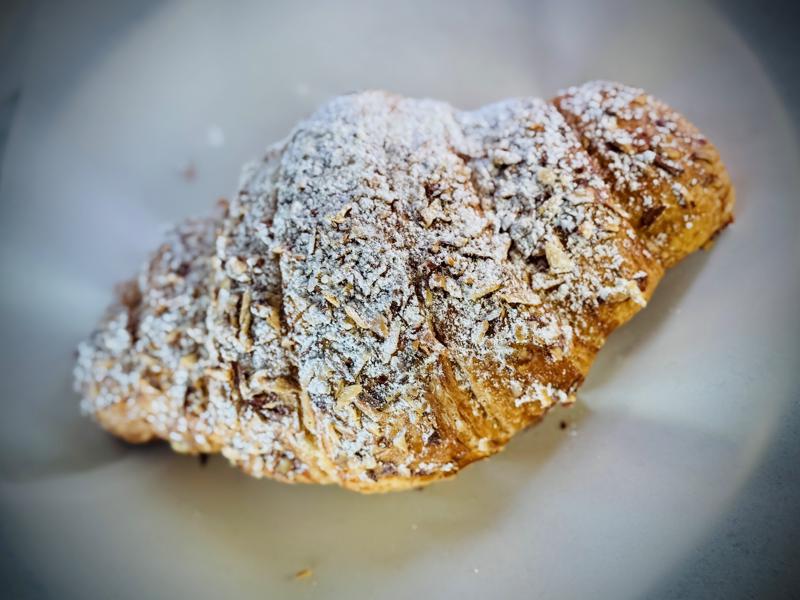 Buttery almond croissant with golden flaky layers