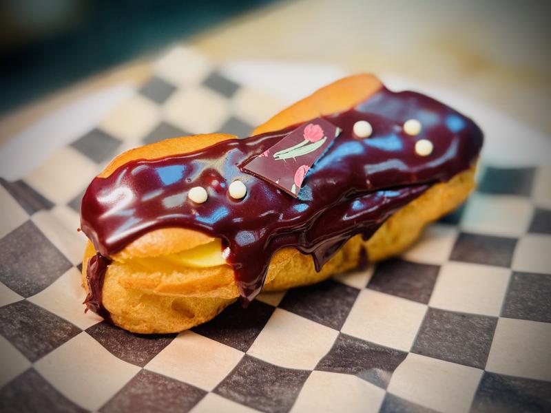 Classic chocolate eclair with cream filling