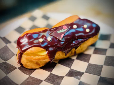 Classic chocolate eclair with cream filling