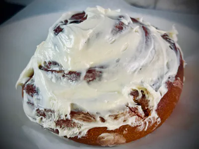 Fresh cinnamon roll with cream cheese frosting