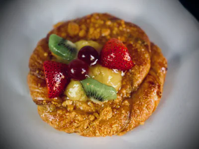 Fruit-topped Danish pastries with flaky crusts